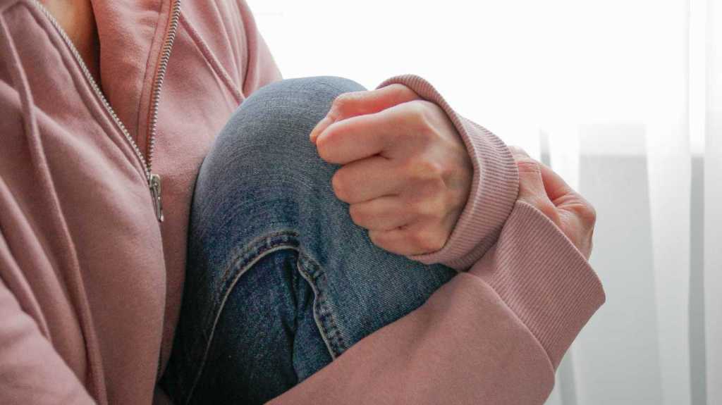 Woman shows signs of emotional stress.