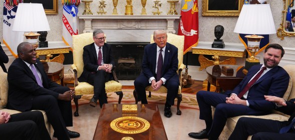 UK Prime Minister Sir Keir Starmer meets with U.S. President Donald Trump, alongside U.S. Vice President JD Vance (R) and UK Foreign Secretary David Lammy (L) in the Oval Office at the White House on February 27, 2025 in Washington, DC.