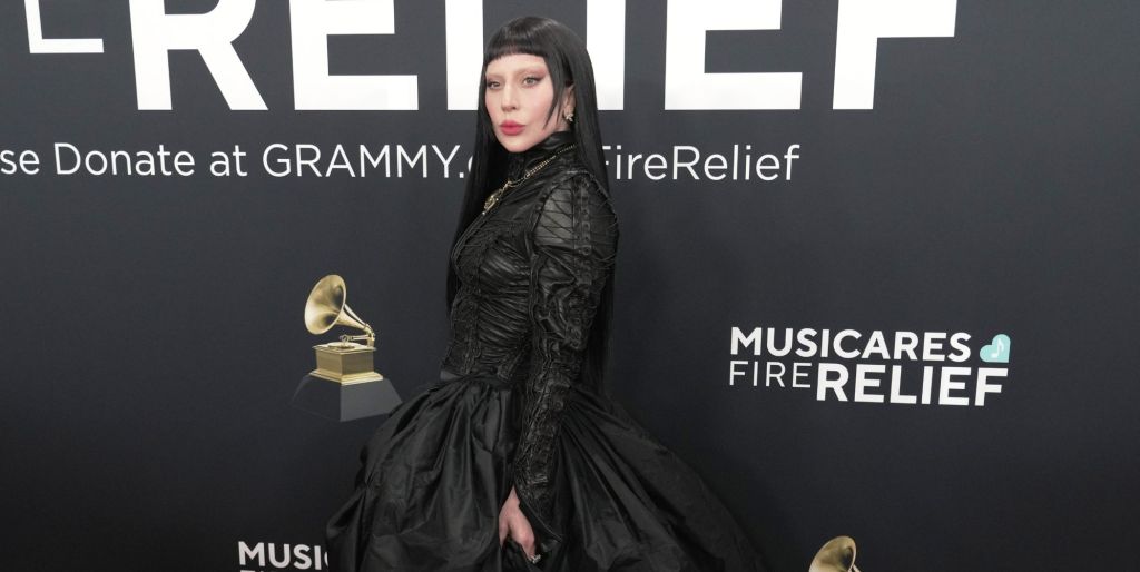 Lady GAGA in a black dress with black hair on the red carpet at the Grammy Awards 2025