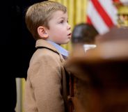 Elon Musk's son, X, standing next to Donald Trump.