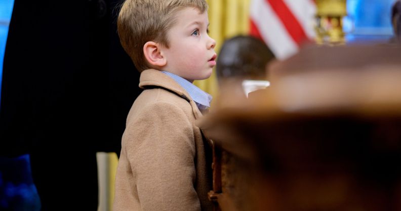 Elon Musk's son, X, standing next to Donald Trump.