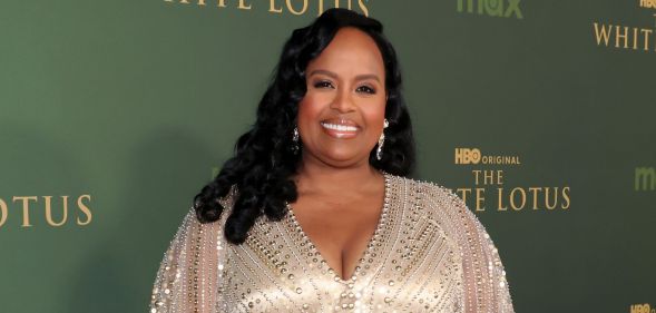 Natasha Rothwell in a matte dress smiling at the premiere of The White Lotus season three