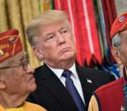 US President Donald Trump listens with Navajo Code Talkers in the Oval Office of the White House in November 2017.