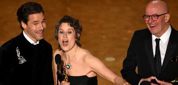 French composer Clement Ducol, French composer Camille and French director Jacques Audiard accept the award for Best Original Song for 'El Mal' from 'Emilia Perez'.