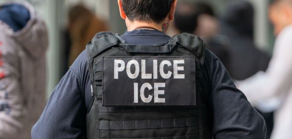 The back of an ICE officer.