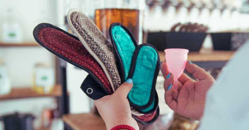 A woman holds sustainable period products.