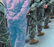 A military line-up, with one soldier in the trans colours.