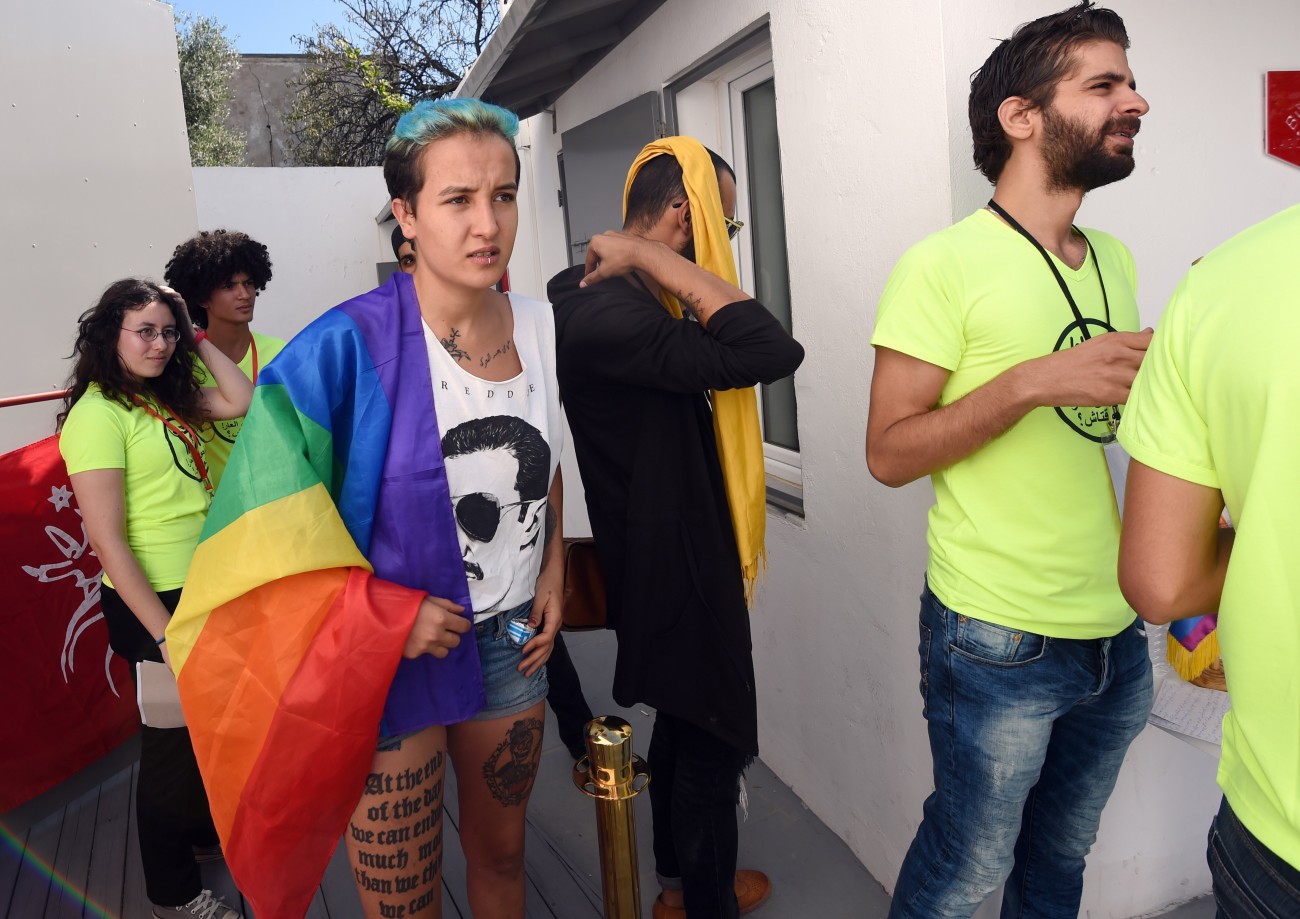 Former Tunisian Femen activist Amina Sboui (C) and members of Tunisian "Shams" association for the decriminalisation of homosexuality, wait before a press conference to support a 22-year-old man accused of engaging in homosexual acts and sentenced to a year in prison following an anal examination on October 3, 2015 in Tunis. The local rights groups ATSM and Shams condemned the judgement, calling anal exams "scandalous" and ask for decriminalising homosexuality by revising Article 230 of the penal code, according to which sodomy between consenting adults is punishable by up to three years in prison. AFP PHOTO / FETHI BELAID        (Photo credit should read FETHI BELAID/AFP/Getty Images)