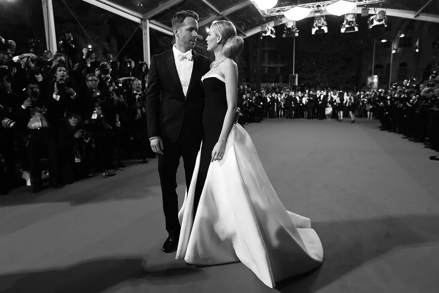 BLACK AND WHITE VERSION Canadian actor Ryan Reynolds and his wife US actress Blake Lively pose as they arrive for the screening of the film "Captives" at the 67th edition of the Cannes Film Festival in Cannes, southern France, on May 16, 2014.   AFP PHOTO / VALERY HACHE        (Photo credit should read VALERY HACHE/AFP/Getty Images)