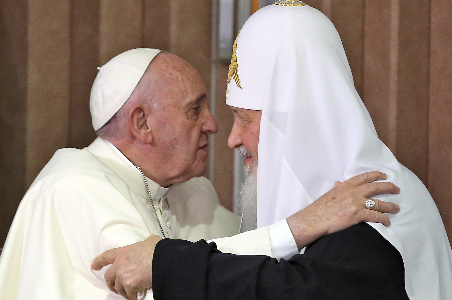 Pope Francis (L) and the head of the Russian Orthodox Church, Patriarch Kirill (R), approach to kiss during a historic meeting in Havana on February 12, 2016. Pope Francis and Russian Orthodox Patriarch Kirill kissed each other and sat down together Friday at Havana airport for the first meeting between their two branches of the church in nearly a thousand years. AFP PHOTO / POOL - Alejandro Ernesto / AFP / POOL / ALEJANDRO ERNESTO (Photo credit should read ALEJANDRO ERNESTO/AFP/Getty Images)