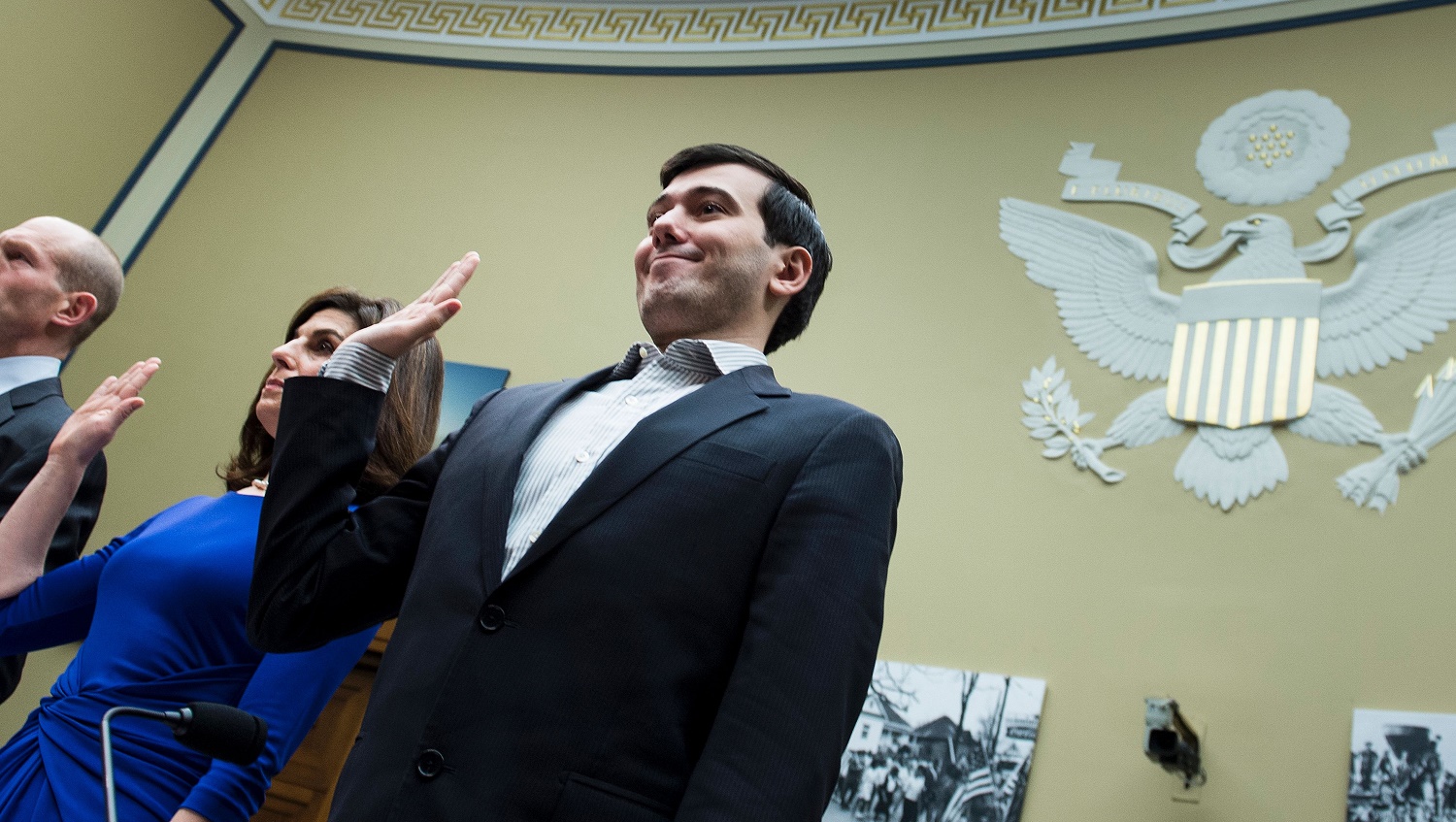 Entrepreneur and pharmaceutical executive Martin Shkreli (R) is sworn in with others during a hearing of the House Oversight and Government Reform Committee on Capitol Hill February 4, 2016 in Washington, DC. Martin Shkreli, the controversial former pharmaceuticals boss and hedge fund manager indicted on securities fraud charges, has been subpoenaed to appear at a hearing of a House of Representatives committee on oversight and government reform looking at the prescription drug market. / AFP / Brendan Smialowski        (Photo credit should read BRENDAN SMIALOWSKI/AFP/Getty Images)