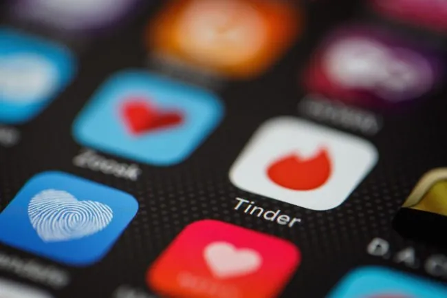 Shot of apps on a display with Tinder prominent