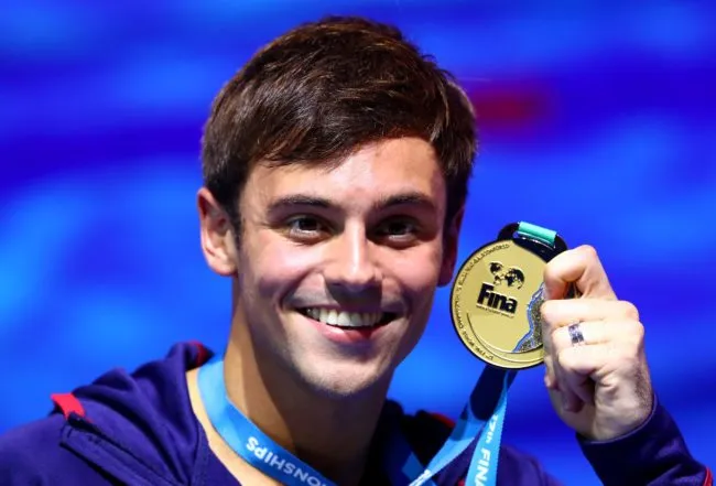 Tom Daley poses with his gold medal, 2017