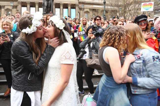 Couples kiss at the conclusion of an Illegal Wedding
