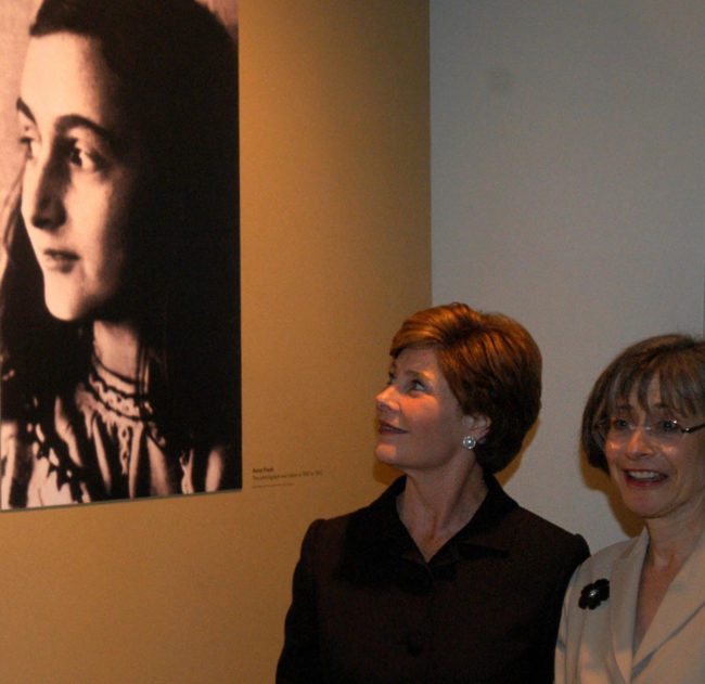 US First Lady Laura Bush looks at a photograph of Anne Frank with Sara Bloomfield (R), director of the United States Holocaust Museum, to honor the opening of the museum's exhibition of Anne Frank's original writings 11 June 2003 in Washington, DC. This is the first time her original writings have been on display outside the Netherlands. AFP PHOTO/NICHOLAS ROBERTS  (Photo credit should read NICHOLAS ROBERTS/AFP/Getty Images)