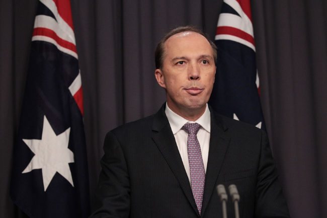 CANBERRA, AUSTRALIA - MAY 03: Immigration Minister Peter Dutton speaks to the media at Parliament House on May 3, 2016 in Canberra, Australia. Hodan Yasin, a 21-year-old Somali refugee has arrived for treatment in Brisbane after setting herself on fire while being detained in Nauru. It is the second attempt on Nauru in a week, after Iranian refugee Omid Masoumali set himself on fire last Wednesday. He later died from his injuries. (Photo by Stefan Postles/Getty Images)