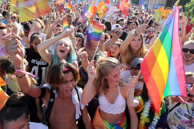 People take part in the Pink Parade; the Lesbian, Gay, Bisexual and Transgender (LGBT) Pride celebration in Nice, southeastern France, on August 5, 2017.   / AFP PHOTO / VALERY HACHE        (Photo credit should read VALERY HACHE/AFP/Getty Images)