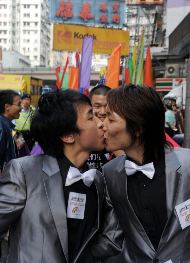 Rally participants take part in a gay and lesbian rally through the streets in Hong Kong on December 13, 2008. Hundreds marched to promote the rights of the gay and lesbian community in the territory. AFP PHOTO/CHEUNG KA CHUN (Photo credit should read CHEUNG KA CHUN/AFP/Getty Images)