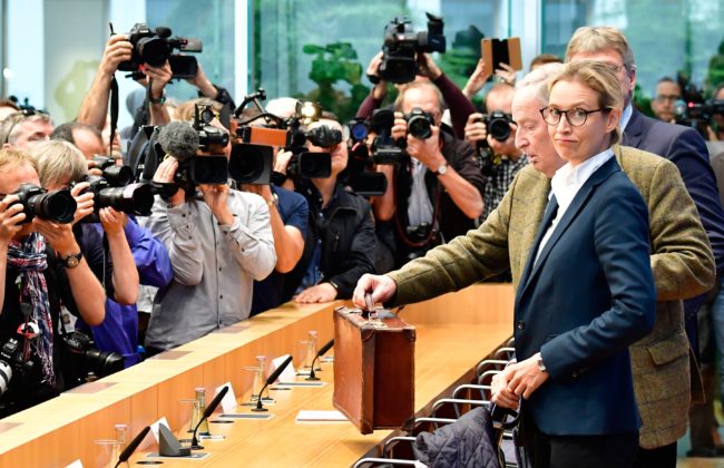 Joerg Meuthen (R, hidden), co-leader of Germany's nationalist Alternative for Germany (AfD) party, AfD top candidate Alexander Gauland (3rd R) and AfD top candidate Alice Weidel (2nd R) arrive for a press conference of the AfD in Berlin on September 25, 2017, one day after general elections. Frauke Petry, co-chief of the nationalist Alternative for Germany party, declared she would not join her party's parliamentary group amid a bitter dispute with more hardline colleagues. / AFP PHOTO / Tobias SCHWARZ (Photo credit should read TOBIAS SCHWARZ/AFP/Getty Images)