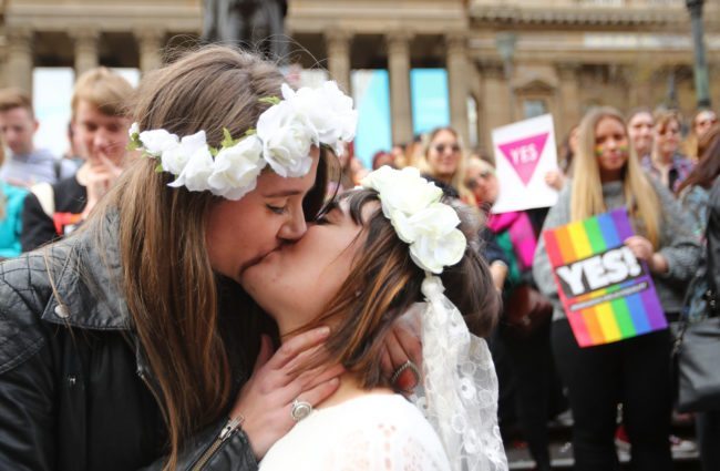 MELBOURNE, AUSTRALIA - AUGUST 26: A couple kiss at the conclusion of a mock wedding at the State Library of Victoria during a Rally For Marriage Equality on August 26, 2017 in Melbourne, Australia. This month marks thirteen years since the Marriage Act was amended to restrict marriage rights to heterosexual couples. Australia is now preparing for postal vote on whether same-sex marriage should be legalised. The Australian Marriage Law Postal Survey is due to be sent out by the Australian Bureau of Statistics on September 12. (Photo by Scott Barbour/Getty Images)