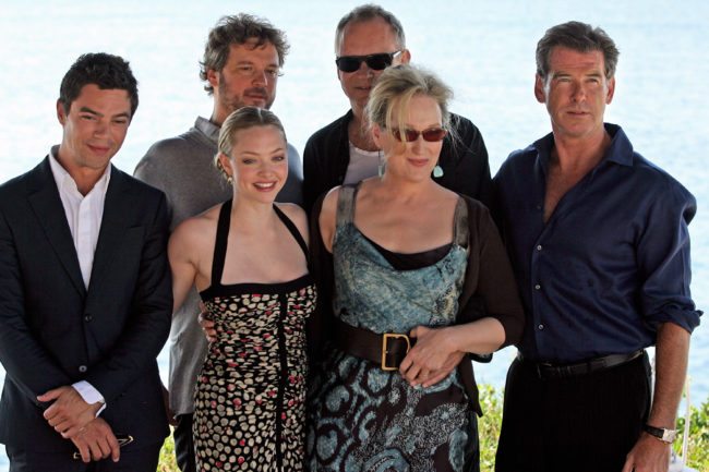 (From L to R) British actor Dominic Cooper, British actor Colin Firth, US actress Amanda Seyfried, Swedish actor Stellan Skarsgard, US actress Meryl Streep and Irish actor Pierce Brosnan pose during a photo opportunity for the promotion of the new movie "Mamma Mia" at the Lagonissi Grand Resort, some 40 kms south of Athens on June 28, 2008.      AFP PHOTO / Aris Messinis        (Photo credit should read ARIS MESSINIS/AFP/GettyImages)