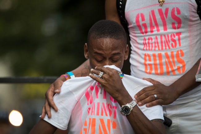 NEW YORK, NY - JUNE 12: Keion Carter, survivor of the 2016 Pulse nightclub shooting, breaks down while speaking the audience during a memorial service and rally for the victims of the 2016 Pulse nightclub shooting, down the street from the historic Stonewall Inn June 12, 2017 in New York City. Monday marks the one year anniversary of the Pulse nightclub shooting in Orlando, Florida that killed 49 people. (Photo by Drew Angerer/Getty Images)