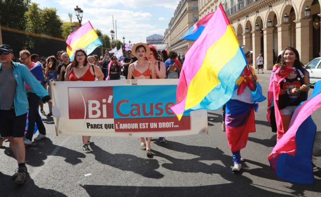 Activists wear costumes and march behind a banner as they take part in the Gay Pride parade in Paris on June 24, 2017.  2017 marks the 40th anniversary of the first Gay Pride March in the French capital.  / AFP PHOTO / JACQUES DEMARTHON        (Photo credit should read JACQUES DEMARTHON/AFP/Getty Images)