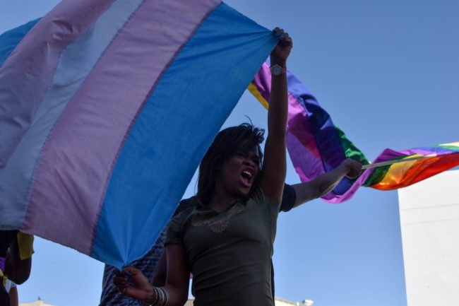 Dozens of people cheer and dance as they take part in the Namibian Lesbians, Gay, Bisexual and Transexual (LGBT) community pride Parade in the streets of the Namibian Capitol on July 29, 2017 in Windhoek. Even though there have been marches and protests against discrimination against the LGBT community in the past years, this is the first time that the community held such a parade along the capital's main street, Independence Avenue, to celebrate their identity and rights. / AFP PHOTO / Hildegard Titus (Photo credit should read HILDEGARD TITUS/AFP/Getty Images)