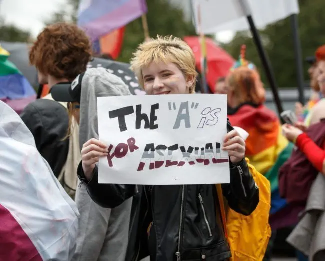 GLASGOW, SCOTLAND - AUGUST 19: A participant holds a sign that says "The "A" is for asexual" during the Glasgow Pride march on August 19, 2017 in Glasgow, Scotland. The largest festival of LGBTI celebration in Scotland has been held every year in Glasgow since 1996. (Photo by Robert Perry/Getty Images)