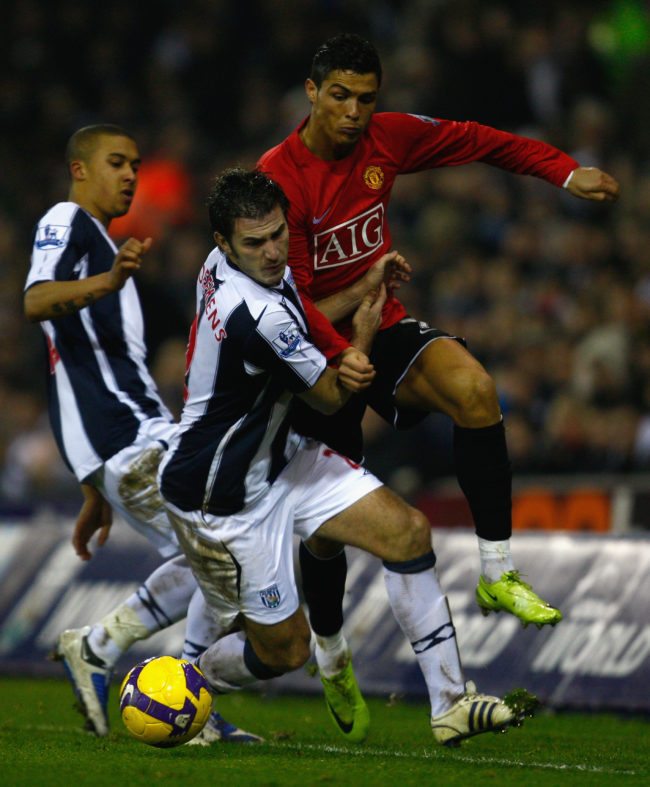 WEST BROMWICH, UNITED KINGDOM -JANUARY 27:   Carl Hoefkens of West Bromwich Albion battles for the ball with Cristiano Ronaldo of Manchester United during the Barclays Premier League match between West Bromwich Albion and Manchester United at The Hawthorns on January 27, 2009 in West Bromwich, England.  (Photo by Mark Thompson/Getty Images)