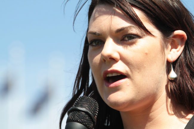 CANBERRA, AUSTRALIA - SEPTEMBER 28:  Australian Green's Senator Sarah Hanson-Young addresses the crowd during a Free the Refugees rally on opening day of Australia's 43rd parliament at Parliament House September 28, 2010 in Canberra, Australia. The opening comes five weeks after the federal election resulted in a hung parliament and left the country waiting while Independent MPs deliberated to ultimately form a minority government.  (Photo by Cole Bennetts/Getty Images)
