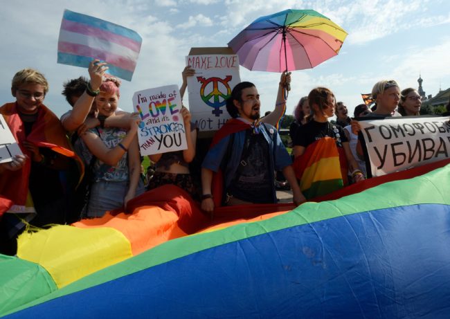 People wave gay rights' movement rainbow flags during the gay pride rally in Saint Petersburg, on August 12, 2017. / AFP PHOTO / OLGA MALTSEVA (Photo credit should read OLGA MALTSEVA/AFP/Getty Images)