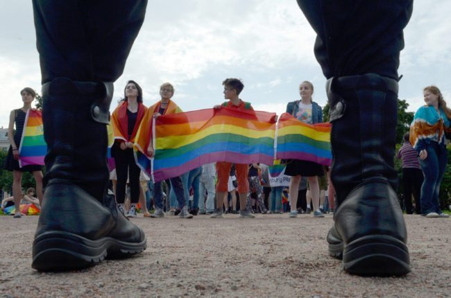 People wave gay rights' movement rainbow flags during the gay pride rally in Saint Petersburg, on Agust 12, 2017. / AFP PHOTO / OLGA MALTSEVA (Photo credit should read OLGA MALTSEVA/AFP/Getty Images)