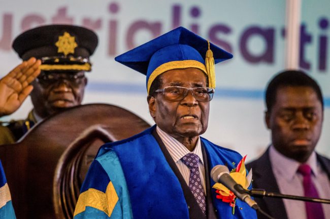 Zimbabwe's President Robert Mugabe delivers a speech during a graduation ceremony at the Zimbabwe Open University in Harare, where he presides as the Chancellor on November 17 2017.  Zimbabwean President Robert Mugabe attended a university graduation ceremony today, making a defiant first public appearance since the military takeover that appeared to signal the end of his 37-year reign. / AFP PHOTO / -        (Photo credit should read -/AFP/Getty Images)