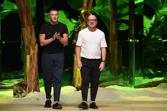 Designers Domenico Dolce (R) and Stefano Gabbana greet the audience at the end of the show for fashion house Dolce Gabbana during the 2017 Women's Spring / Summer collections shows at Milan Fashion Week on September 25, 2016 in Milan. / AFP / ALBERTO PIZZOLI (Photo credit should read ALBERTO PIZZOLI/AFP/Getty Images)