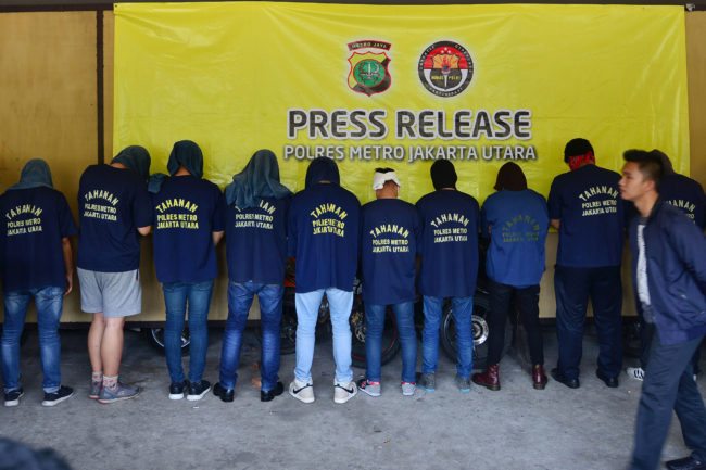 Men arrested in a recent raid stand in line during a press conference at a police station in Jakarta on May 22, 2017.  Indonesian police have detained 141 men who were allegedly holding a gay party at a sauna, an official said on May 22, the latest sign of a backlash against homosexuals in the Muslim-majority country. / AFP PHOTO / FERNANDO        (Photo credit should read FERNANDO/AFP/Getty Images)