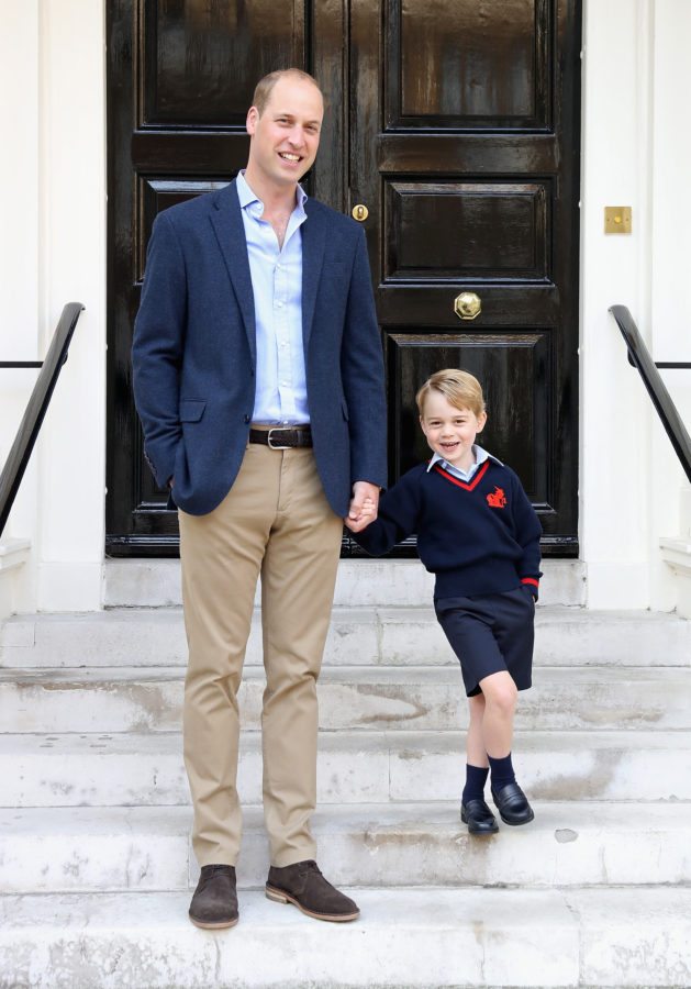 LONDON, ENGLAND - SEPTEMBER 07: (In this handout photo released by the Duke and Duchess of Cambridge) Prince William, the Duke of Cambridge with his son Prince George on his first day of school on September 7, 2017 in London, England. The picture was taken at Kensington Palace in London shortly before Prince George left for his first day of school at Thomas's Battersea. Photographer Chris Jackson who took the picture said “The first day of school is an exciting time for any child, and it was great to see Prince George with a big smile on his face next to Dad, The Duke of Cambridge, ahead of their first school run together.” (Photo by Chris Jackson/Getty Images) NEWS EDITORIAL USE ONLY. NO COMMERCIAL USE (including any use in merchandising, advertising or any other non-editorial use including, for example, calendars, books and supplements). This photograph is provided to you strictly on condition that you will make no charge for the supply, release or publication of it and that these conditions and restrictions will apply (and that you will pass these on) to any organisation to whom you supply it. All other requests for use should be directed to the Press Office at Kensington Palace in writing.