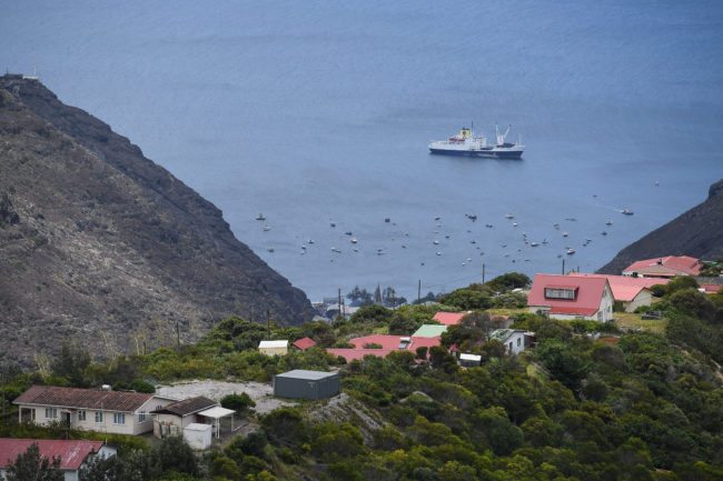 JAMESTOWN, SAINT HELENA - OCTOBER 27:  The RMS "St Helena" sails in the harbour on October 26, 2017 in Jamestown, Saint Helena. Following the introduction of weekly flights to the island, resident St Helenians, known locally as "Saints", are preparing for a potential influx of tourists and investment as well as enjoying the possibilities brought by much faster transport links with South Africa. Previously, travel to the island involved travelling for a week by the Royal Mail Ship (RMS) "Saint Helena" from Cape Town. Saint Helena is a 46 square mile island in the South Atlantic which has been under British control since 1834.  (Photo by Leon Neal/Getty Images)