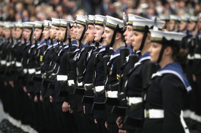 Members of the ship's company are seen during the Commissioning Ceremony for the Royal Navy aircraft carrier HMS Queen Elizabeth on board the ship at HM Naval Base in Portsmouth, southern England on December 7, 2017.  Her Majesty The Queen, accompanied by Her Royal Highness The Princess Royal, attended the Commissioning Ceremony of the aircraft carrier HMS Queen Elizabeth, the largest warship ever built for the Royal Navy.  / AFP PHOTO / POOL / Chris Jackson        (Photo credit should read CHRIS JACKSON/AFP/Getty Images)