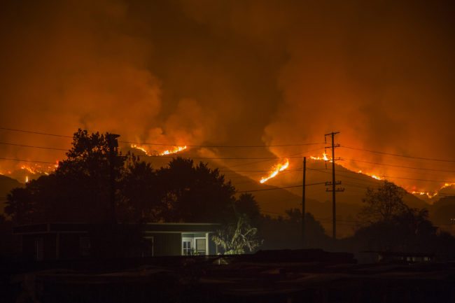 CARPINTERIA, CA - DECEMBER 10: The growing Thomas Fire advances toward Santa Barbara County seaside communities on December 10, 2017 in Carpinteria, California. The Thomas Fire has grown to 173,000 acres and destroyed at least 754 structures so far. Strong Santa Ana winds have been feeding major wildfires all week, destroying houses and forcing tens of thousands of people to evacuate.  (Photo by David McNew/Getty Images)