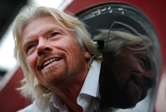 British entrepreneur Sir Richard Branson leans out of the window of the drivers cab on board a Virgin Pendolino train at Lime Street Station in Liverpool, north-west England, on March 13, 2012, as he prepares to launch a Global Entrepreneurship Congress. The event aims to be the largest gathering of start-up champions from around the world. AFP PHOTO/PAUL ELLIS (Photo credit should read PAUL ELLIS/AFP/Getty Images)