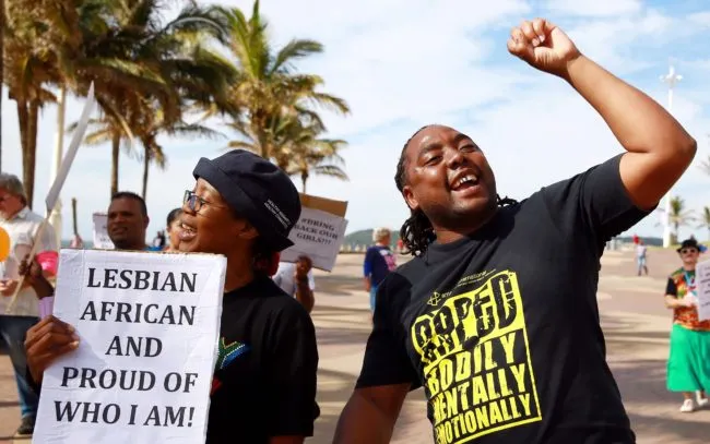 Gay rights activists participate in a demonstration rally marking the International Day Against Homophobia and Transphobia (IDAHOT) at the North Beach in Durban, on May 17, 2014. The 9th annual event, billed by organisers as the biggest LGBT solidarity event in the world, is aimed at raising awareness about discrimation facing the community and at calling for equal rights. AFP PHOTO / RAJESH JANTILAL        (Photo credit should read RAJESH JANTILAL/AFP/Getty Images)
