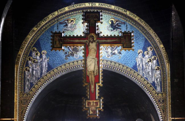 A cross with a painting of Jesus Christ (Photo by Peter Macdiarmid/Getty Images)