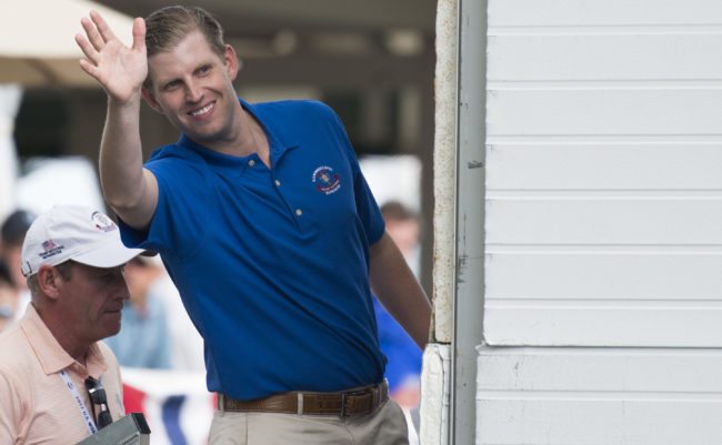 Eric Trump, son of US President Donald Trump, waves to wellwishers during the 72nd US Women's Open Golf Championship at Trump National Golf Course in Bedminster, New Jersey, July 15, 2017. / AFP PHOTO / SAUL LOEB        (Photo credit should read SAUL LOEB/AFP/Getty Images)