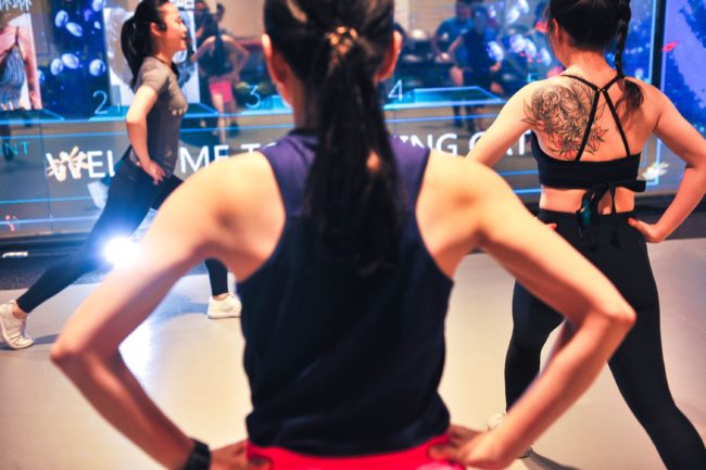 This photo taken on July 28, 2017 shows runners training in a gym in Shanghai. A growing number of young, educated, urban Chinese are shrugging off the myriad hazards to keep fit through serious running and the number of marathons and running events in the country is mushrooming. / AFP PHOTO / STR / China OUT / TO GO WITH AFP STORY LIFESTYLE-CHINA-RUNNING-HEALTH-POLLUTION,FEATURE BY PETER STEBBINGS (Photo credit should read STR/AFP/Getty Images)