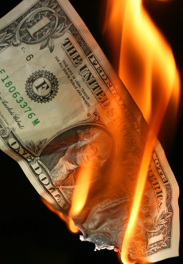 MANCHESTER, UNITED KINGDOM - OCTOBER 24:  In this photo illustration, an America one USD note burns on October 24, 2008 in Manchester, England. As markets across the globe continue to struggle, the world wide credit crunch begins to bite deeper with fears of economic recession  (Photo by Christopher Furlong/Getty Images)