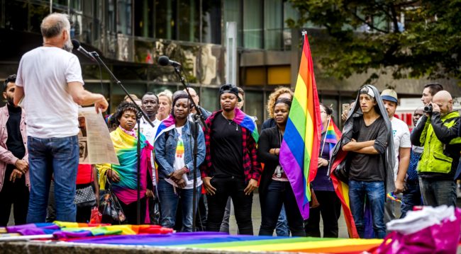 Members of the LGBT (lesbian, gay, bisexual, and transgender) community who are also migrants or refugees, demonstrate to demand better recognition in The Hague, on September 5, 2017. / AFP PHOTO / ANP / Remko DE WAAL / Netherlands OUT (Photo credit should read REMKO DE WAAL/AFP/Getty Images)