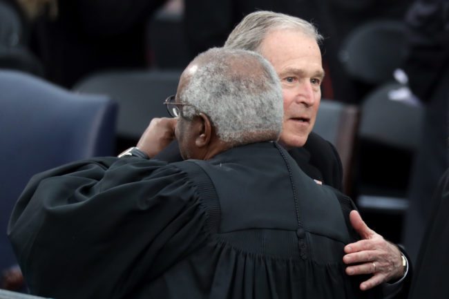 WASHINGTON, DC - JANUARY 20:  Former President George W. Bush (R) greets Supreme Court Justice Clarence Thomas on the West Front of the U.S. Capitol on January 20, 2017 in Washington, DC. In today's inauguration ceremony Donald J. Trump becomes the 45th president of the United States.  (Photo by Chip Somodevilla/Getty Images)