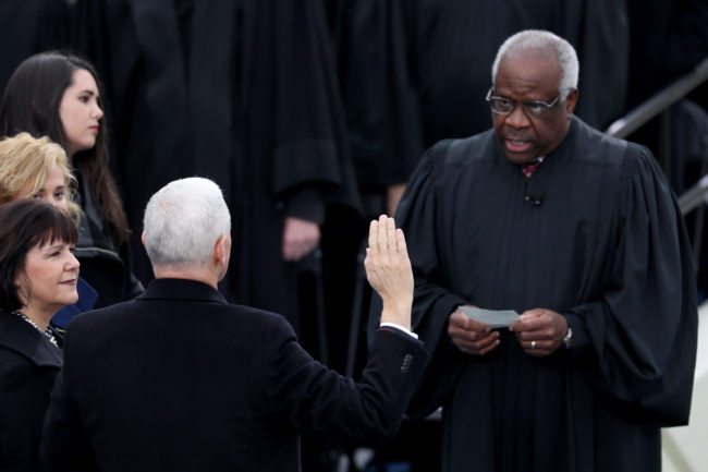 WASHINGTON, DC - JANUARY 20:  Vice President Mike Pence takes the oath of office from Supreme Court Clarence Thomas as wife Karen Pence holds a bible on the West Front of the U.S. Capitol on January 20, 2017 in Washington, DC. In today's inauguration ceremony Donald J. Trump becomes the 45th president of the United States.  (Photo by Joe Raedle/Getty Images)