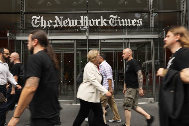 NEW YORK, NY - JULY 27:  People walk past the New York Times building on July 27, 2017 in New York City.  The New York Times Company shares have surged to a nine-year high after posting strong earnings on Thursday. Partly due to new digital subscriptions following the election of Donald Trump as president, the company reported a profit of $27.7 million in the second quarter, up from $9.1 million in the same period last year.  (Photo by Spencer Platt/Getty Images)